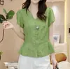Popular Blusa de Manga Corta Plisada con Cuello en V Estilo Francés Ajustada a la Cintura Moda Verano 2026 Chic Color Sólido