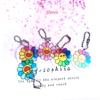 Nueva Cadena de Cuentas de Crisantemo con Carita Sonriente Acrílica Pequeño Colgante Colgante para Caja de Audífonos Bolsa Decorativa Pequeña Joyería