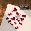 Accesorios Populares para Uñas con Forma de Moño Resina Borgoña Cinta Flujo Mini Pajarita Estéreo Accesorios para Uñas Venta al por Mayor