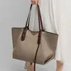 Bolsa de Mano 2026 Estilo Nuevo Lona para Mujer Sensación de Alta Gama Gran Capacidad Bolso de Hombro para Viajero Bolso Grande Equipaje