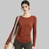 Conjunto de yoga de dos piezas de nuevo estilo para mujer, adecuado para usar como ropa exterior en otoño, top de entrenamiento de Pilates de manga larga con sujetador incorporado, top de fitness al por mayor