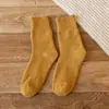 Calcetines de rizo para hombre y mujer calcetines de invierno engrosados de longitud media calcetines de anillo de lana calcetines de mujer color liso calcetines cálidos de toalla venta al por mayor