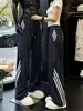 Pantalones deportivos de pierna recta a bloques de color a rayas estilo americano en azul marino para hombre, adecuados para primavera y otoño, marca moderna versátil casual, pantalones casuales de pierna ancha holgados