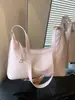 Bolso de axila texturizado transfronterizo para mujer, nuevo modelo 2026, bolso simple de media luna, bolso versátil para hombro y cruzado