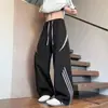 Calças casuais listradas color-blocking estilo americano de secagem rápida para homens, finas de verão para esportes ao ar livre, tendência solta nicho calças de caminhada