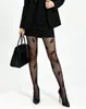 Medias de seda negras para mujer estilo vintage francés con estampado floral flocado y patrón sutil, populares en línea, medias de alta gama, en stock para venta al por mayor