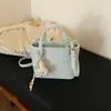 Bolso de Mano de Moda para Mujer Estilo Ins 2026 Verano Nuevo Modelo Bolso de Hombro Cruzado Personalizado Color Sólido Bolso Cubo de Moda