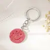 Fabricantes suministran llavero colgante de cara sonriente acrílica para mujer, llavero simple, accesorios colgantes para bolso