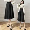 Nueva falda de lana de otoño e invierno con un dobladillo grande para cubrir las caderas, falda midi de lana de retazos para mujer