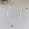 Collar de perlas de arroz naturales extremadamente pequeñas para mujer, estilo retro, elegante, combinable con todo, cadena de clavícula, suministro directo de fábrica.
