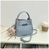 Bolso Cubo de Mano de Nicho Estilo Coreano para Mujer 2026 Primavera Nuevo Moda Bolso de Hombro Único Bolso Cruzado Simple de Alto Valor