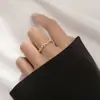 Anillo de plata bañado estilo coreano temperamento fresco dulce hueco cruz ola diamante femenino nicho alto 2022 Nuevo