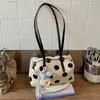 Bolsa de almohada de lunares nueva de verano transfronteriza 2026, diseño de nicho, bolso de hombro moderno y versátil, bolso para el antebrazo para ir al trabajo