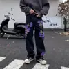 Novas calças pretas retas unissex transfronteiriças com patches de couro cruzados estilo americano, jeans longos da moda de marca de alta rua na cor roxo leopardo