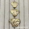 Botones metálicos con textura de concha marina para trajes, abrigos de lana tejidos, botones decorativos simples y versátiles cosidos a mano