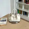 Bolso de mano de alta gama para mujer 2026 nuevo moda de verano versátil bolso de hombro bolso cruzado tipo cubo para el día a día