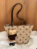 Bolso de gamuza vintage de nicho para mujer para otoño e invierno, nuevo bolso de hombro casual para el día a día 2026, bolso de mano tipo cubo