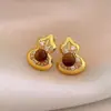 Brincos Olho de Tigre Estilo Melanoid Retro Senso de Design de Nicho Brincos Versáteis Luxo Leve Moda de Alta Qualidade Brincos de Tarraxa para Mulheres