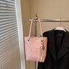 Bolso pequeño en relieve de color popular de este año para mujer 2025 nuevo bolso de hombro versátil para ir al trabajo, bolso de cubo supercaliente de primavera