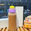 Nueva botella de agua térmica estilo macarrón de comercio exterior, hecha de acero inoxidable 304, con tapa abatible portátil, adecuada para hombres, mujeres y estudiantes; una botella de agua linda