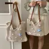 Bolso personalizado estilo resort al por mayor para mujer, nuevo bolso de hombro tejido calado para el verano 2026, bolso de axila de moda