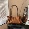 Bolso de hombro tipo cubo para ir al trabajo, nuevo bolso casual de gamuza de lujo ligero para mujer, bolso de nicho de moda 2026 con un toque vintage