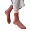 Calcetines de rizo para hombre y mujer calcetines de invierno engrosados de longitud media calcetines de anillo de lana calcetines de mujer color liso calcetines cálidos de toalla venta al por mayor
