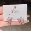Pendientes de botón tipo ramo de flores de circonita cúbica, ligeros y lujosos, para mujer, estilo coreano, modernos y elegantes, con pasador de plata, nueva colección 2026