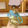Shuibei Oro 999 Llénalo de Dinero Inmediatamente Colgante Llavero Lindo Dibujo Animado Pareja Hombre y Mujer Colgante para Coche Bolso