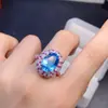 Anillo con Topacio Natural Puro Azul Suizo de un Color Súper Profundo de 10*14mm. Incrustación de Trabajo Fino en Plata 925