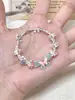 Pulsera tejida vintage Ice Star 2024, estilo nuevo, flor azul leche blanca, pulsera de verano sencilla y combinable.