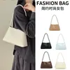 Bolso de axila ligero y lujoso con textura tejida para mujer, nuevo modelo transfronterizo 2026, bolso de mano elegante, bolso de hombro, bolso baguette para el día a día