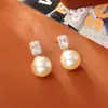 Suministro Directo de Fábrica Pendientes de Perla de Vidrio Shijia Moda de Gama Alta Exquisitos Pendientes de Zirconia Cubo de Azúcar Joyería Estilo Socialité