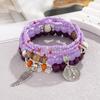 Conjunto de Pulseras de Múltiples Capas con Alas de Ángel de Cuentas Millet Transfronterizas Conjunto de Pulseras de Cuentas Étnicas Bohemias Coloridas