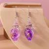 Pendientes de concha luminosa transfronterizos de Europa y América, diseño creativo de moda, pendientes de concha transparente luminosos de noche.