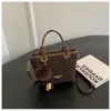 Bolso de mano de alta gama con estampado de leopardo para mujer, nuevo y elegante bolso tipo cubo retro, bolso de hombro de nicho estilo coreano