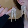 Pendientes elegantes con borlas de diamantes de imitación de aguja plateada, estilo europeo y americano, con diamantes de alta calidad para mujer.