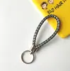 Llavero creativo llavero de cuerda de cuero cordón para llaves colgante de joyería cordón tejido fábrica de cuerda de cuero venta al por mayor