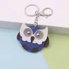 En Stock Pequeño Mini Búho Llavero Colgante de Cuero Búho de Dibujos Animados Alas Giratorias Adorno
