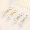 Pendientes de estilo coreano Ji Perla de sirena flor de cuatro pétalos para mujer gancho para la oreja de perla flor trompeta pendientes de temperamento de alta calidad