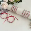Pulsera trenzada con cuentas de aleación y cordón de algodón ajustable, estilo transfronterizo popular en Europa y América, joyería con cuentas redondas para hombres y mujeres