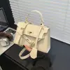 Bolsa de Mão de Alto Valor Estético Nova Moda Primavera 2026 Padrão de Pedra Retrô para Trabalhador de Escritório Deslocamento Casual Tendência Bolsa Transversal