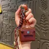 Llavero Colgante para Bolso Cadena para Teléfono Móvil Cachorro de Cabeza Chueca de Cuero PU Personalizado de Nicho Adornos de Alta Gama para Mujer
