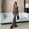 Traje de una sola manga estilo chica picante transfronterizo francés 2026 otoño nueva moda top corto falda de sirena de cintura alta adelgazante