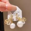 Aretes de moño con perlas y pin de plata con baño de oro real, temperamento retro, aretes de nicho, lujo ligero, aretes de alta gama al por mayor