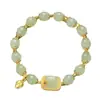 Nuevo brazalete de estilo chino inspirado en el loto con cubos de azúcar de jade Hetian, esmalte chapado en oro y colgante de loto con cuentas de jade lisas