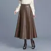 Falda versátil de cuero PU de color sólido para mujer, nuevo estilo otoño 2026, de cintura alta, adelgazante, suelta, falda larga de línea A, moderna