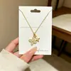Nuevo Collar de Acero de Titanio con Colgante de Trébol de Cuatro Hojas y Estampado de Doble Flor para Mujer, Elegante Cadena para Clavícula con Circonita Exquisita, Joyería de Estilo Lujo Ligero
