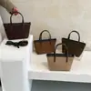 Bolso tote con acabado mate único, casual y versátil, nuevo bolso cubo 2026, bolso cruzado de gamuza retro y moderno