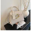 Bolsos de Mujer de Moda de Este Año 2026 Primavera y Otoño Nuevo Bolso Kelly para el Trabajo Pequeño Cuadrado Elegante de Hombro Cruzado